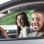 Teenagers driving car